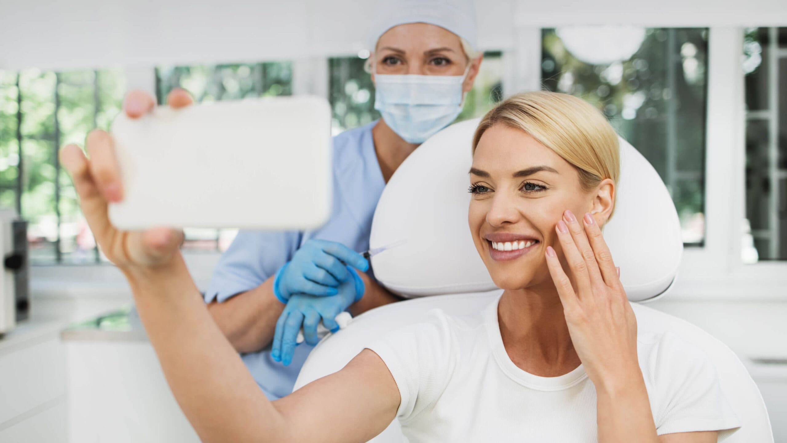 Patient taking selfie with doctor after treatment